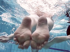 Pretty swimming babe Liza Rachinska shows striptease under the water