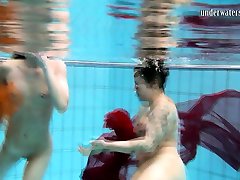 Two underwater girls loving eachother