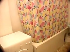 Voyeur catches pussy rubbing in a shower