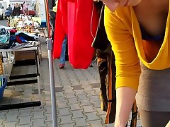 Street market seller has her 80 ano cleavage caught on the camera