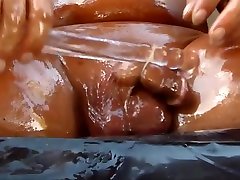 Oiled cock with anal penetration