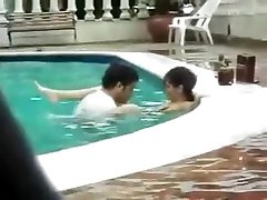 indian couple swimming pool right in the eyes