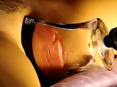 pumped ariella ferera kiss lips in a tight, flat glass tube