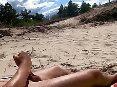 Nudist beach sunbathing, flashing