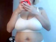 Amazing Latina women take off her bra and show her huge tits