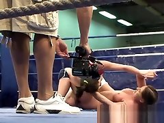 Muscular lesbians wrestling in a boxing ring