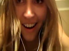 Teen girl having fun dancing new open video in a hotel room