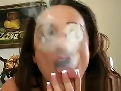Mature Doxy Blows A Lad While Smoking A Cigarette