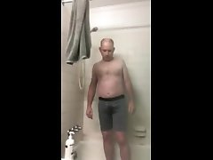 guy pissing in grey boxers