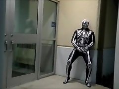 nighttime skeleton jerking off in front of outside doors