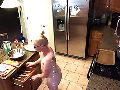 MILF blonde cooking naked