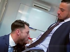 Men in suits enjoy a rough session of steamy sex at work
