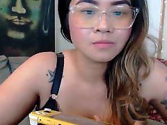 Busty Asian camgirl fondles her huge pierced boobs 2