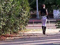 Experienced lady with green eyes is sucking cock in a public place, for some cash