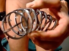 naked bottom exposed cage his big cock with needles cumshot