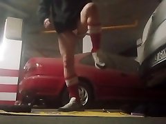 sexy slut fucking his ass with a dildo in a parking lot
