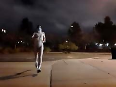 Streaking a street at night under a full moon