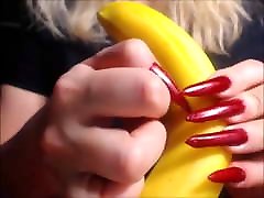 Katiegodess black girls africa sharp red nails sctratching banana