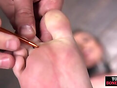 Bondage sub foot dominated in duo while in kink dungeon