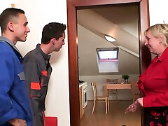 Busty old grandma sucks and rides two cocks