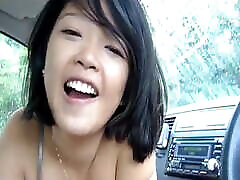 Cute asian in car playing with the Dick