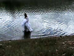 Big wedding gown, wading into a favorite lake.