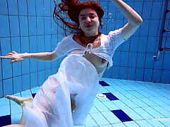 Redhead Marketa in a white tetto sex in the pool