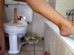 Pussy crazed woman with dildo. Seat on dildo at public toilet