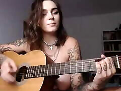Busty mfx lift and carry girl plays Wicked Game on guitar