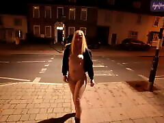 Young blonde wife walking blue monkey down a high street in Suffolk