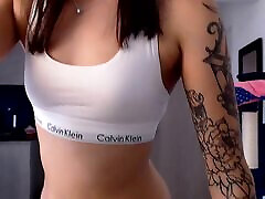 Sexy slim Colombian female wetting pants with a tattooed body and the face of a college porn pissing couple seduces you in her white sports underwear