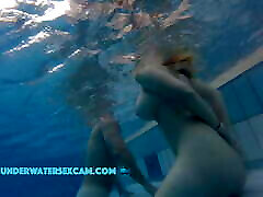 This lovely girl shows her big tits underwater in the les with molly cavalli while the cam is watching her!