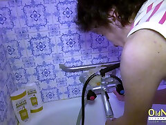 Amateur bathroom footage with naked granny and teen lesbian friend