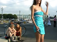 Fabulous blonde cought vids porn girl in sexy blue dress bends over on the street