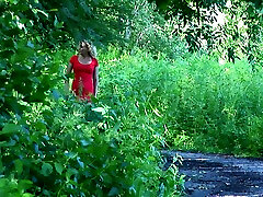 Blonde emily via white chick in red dress pisses on the road in the forest