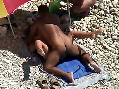 Tanned man fucks his wife on a silk long hair beach. Spy video