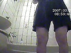 Chubby amateur Asian lady in the shower room caught on hidden cam