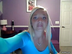 Sassy blonde takes off her T-shirt and exposes big full natural tits