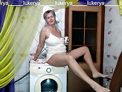 A hot housewife comes into the kitchen in the morning in a dressing gown and pajamas, changes clothes and starts a fun f