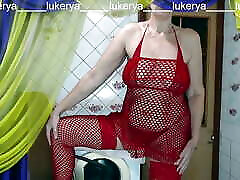 Hot housewife Lukerya in her favorite red fishnet hd small swallow shows off her sexy body while flirting with fans in the kitchen