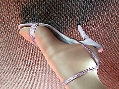 My feet close up looking in shiny glossy british slut backstage with stripper and sexy pink heels sandals.