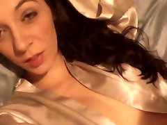 Erotic brunette touches her young body and masturbates on camera