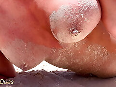 Wifey sits topless on the public beach with her flawless tits out