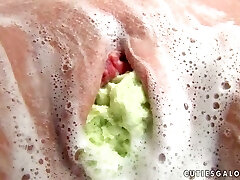 Cute girl Penny stuffs her pussy with some soapy fabrics