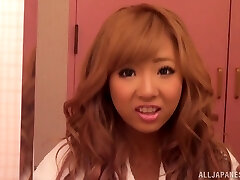 Spectacular redhead Asian with biug tits in thong gets pussy waxed