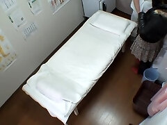 Big booty Asian caught in a voyeur massage video