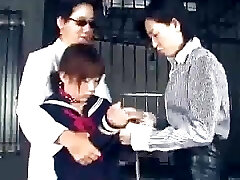 The two lesbian Asian guards bring a poor innocent girl.