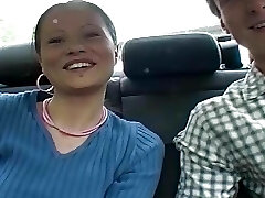 Sexy brunette teen sucking a hard cock in the car