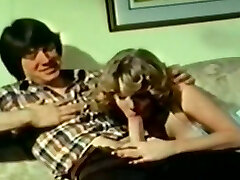 Blonde hot classic hotty with her boyfriend on the sofa