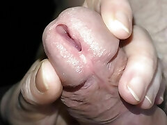 She gropes the penis thru the panties and opens the urethra.